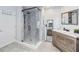 This bathroom features a shower with black trim, a white countertop and grey tiled floors at 1037 Truffles Ct, Apopka, FL 32712