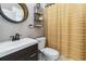 Modern bathroom with a vanity, stylish mirror, and a shower with a decorative curtain at 1037 Truffles Ct, Apopka, FL 32712