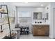 Bright bathroom with a modern vanity, neutral paint, and a large window offering natural light at 1037 Truffles Ct, Apopka, FL 32712