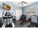 Home gym with workout equipment, including a treadmill, elliptical, and weight bench at 1037 Truffles Ct, Apopka, FL 32712