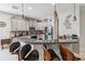 Modern kitchen with stainless steel appliances, granite countertops, and a breakfast bar with stylish seating at 1037 Truffles Ct, Apopka, FL 32712