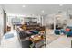 Open-concept layout showcasing a cozy living room with a large sectional couch and modern decor at 1037 Truffles Ct, Apopka, FL 32712