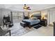 Serene bedroom featuring a large bed, soft lighting, neutral colors, and a ceiling fan at 1037 Truffles Ct, Apopka, FL 32712