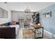This home office features a daybed, a wooden desk, and a blue accent wall at 1037 Truffles Ct, Apopka, FL 32712