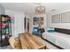Home office featuring a modern desk, daybed, and bright lighting for a productive workspace at 1037 Truffles Ct, Apopka, FL 32712