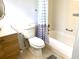 Bathroom featuring tile tub surround, vanity and neutral paint at 1100 E Caroline St # 119, Tavares, FL 32778