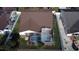 The aerial view reveals the roof, screened pool, and well-manicured backyard with a lovely landscape at 12017 Fambridge, Orlando, FL 32837