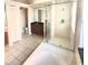 Bright bathroom featuring a soaking tub, frameless shower, tile floors, and updated vanity at 12017 Fambridge, Orlando, FL 32837