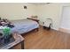 Neutral bedroom features wood-look floors and a rocking chair at 12017 Fambridge, Orlando, FL 32837