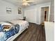 Bedroom with laminated wood floor, ceiling fan, closet, and neutral colored walls at 12017 Fambridge, Orlando, FL 32837