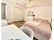 Bedroom with a large window and a bed with pink bedding and a study desk at 12017 Fambridge, Orlando, FL 32837