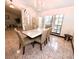 Charming dining room featuring an open floor plan, a chandelier, and six chairs at 12017 Fambridge, Orlando, FL 32837