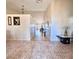 Bright foyer featuring ceramic floors and high ceilings, with a view through to the living room at 12017 Fambridge, Orlando, FL 32837