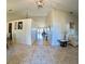 Bright foyer featuring ceramic floors and high ceilings, with a view through to the living room at 12017 Fambridge, Orlando, FL 32837