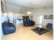 Bright living room featuring an open floor plan, modern ceiling fan, and stylish furniture arrangement at 12017 Fambridge, Orlando, FL 32837