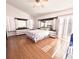 Spacious main bedroom featuring hardwood floors, ensuite bathroom, and bright natural lighting at 12017 Fambridge, Orlando, FL 32837