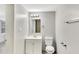 Bathroom featuring a sink vanity, toilet and modern light fixture at 1202 Ferndell Rd, Orlando, FL 32808