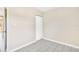 A clean, bright bedroom with tile floors, light walls and natural light at 1202 Ferndell Rd, Orlando, FL 32808