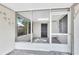 Cozy screened-in porch with a view of the yard and access to the house at 1202 Ferndell Rd, Orlando, FL 32808