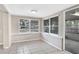 Inviting sun room with tile flooring and bright windows for natural light at 1202 Ferndell Rd, Orlando, FL 32808