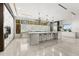 Sleek kitchen with a large island, modern appliances, and a unique backsplash, all bathed in natural light at 12264 Montalcino Cir, Windermere, FL 34786