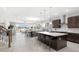 Open-concept kitchen with a center island, modern cabinetry, and stainless steel appliances at 13154 Pergola Ave, Orlando, FL 32832