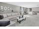Cozy living room with a large sectional, stylish accents, and a staircase view at 13154 Pergola Ave, Orlando, FL 32832