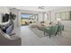 Bright living room with neutral decor, a ceiling fan, and sliding glass doors at 13154 Pergola Ave, Orlando, FL 32832