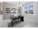 Stylish home office featuring a modern desk, natural light, and elegant decor at 13154 Pergola Ave, Orlando, FL 32832