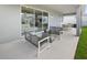 Covered patio with stylish seating and an outdoor dining area at 13154 Pergola Ave, Orlando, FL 32832