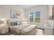 Bright and airy bedroom with stylish furnishings, a large window, and contemporary decor at 15240 Sw 43Rd Ct, Ocala, FL 34473