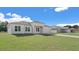 Attractive single-story home with a two-car garage, well-kept lawn, and modern design elements at 15240 Sw 43Rd Ct, Ocala, FL 34473