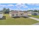 Aerial view of a modern one-story home showcasing its well-kept lawn and surroundings at 15240 Sw 43Rd Ct, Ocala, FL 34473