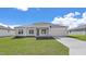 Charming single-story home with a well-manicured lawn and an attached two-car garage at 15240 Sw 43Rd Ct, Ocala, FL 34473