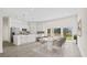 Modern open-concept kitchen with stainless steel appliances, a spacious island, and dining area at 15240 Sw 43Rd Ct, Ocala, FL 34473