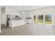 Open-concept kitchen featuring a central island, stainless steel appliances, and bright white cabinetry at 15240 Sw 43Rd Ct, Ocala, FL 34473