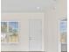 Bright living room with a window overlooking the front yard at 15240 Sw 43Rd Ct, Ocala, FL 34473
