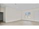 Bright living area with wood-look flooring, neutral paint, recessed lighting, and a large window at 15240 Sw 43Rd Ct, Ocala, FL 34473