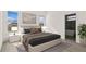 Bright main bedroom featuring a plush bed, stylish nightstands, and an ensuite bathroom at 15240 Sw 43Rd Ct, Ocala, FL 34473