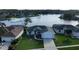 Stunning aerial view of house showcasing manicured landscaping and a peaceful lakeside setting at 1646 Arash Cir, Port Orange, FL 32128