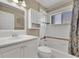 Bright bathroom with tub and shower combination and white vanity at 1646 Arash Cir, Port Orange, FL 32128