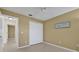 Bedroom with a double door closet and light tile floors at 1646 Arash Cir, Port Orange, FL 32128