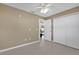 Neutral bedroom featuring tile flooring and a double door closet at 1646 Arash Cir, Port Orange, FL 32128