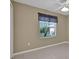 Tan bedroom featuring tile flooring, window and ceiling fan at 1646 Arash Cir, Port Orange, FL 32128