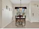 Cozy dining area with seating for six, pendant lighting, and a big window at 1646 Arash Cir, Port Orange, FL 32128