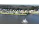 Lakefront homes with mature landscaping, screened enclosures, and serene views at 1646 Arash Cir, Port Orange, FL 32128