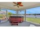 Relaxing screened-in lanai featuring a lake view and a private hot tub to enjoy the outdoors at 1646 Arash Cir, Port Orange, FL 32128