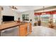 Open kitchen features a sink island with a view and cozy breakfast nook with bay windows and water views at 1646 Arash Cir, Port Orange, FL 32128