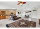 Open-concept living space featuring tile floors, open views of the kitchen, and a dining room area at 1646 Arash Cir, Port Orange, FL 32128