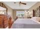 Cozy main bedroom with a decorative ceiling fan and lots of natural light from the window at 1646 Arash Cir, Port Orange, FL 32128